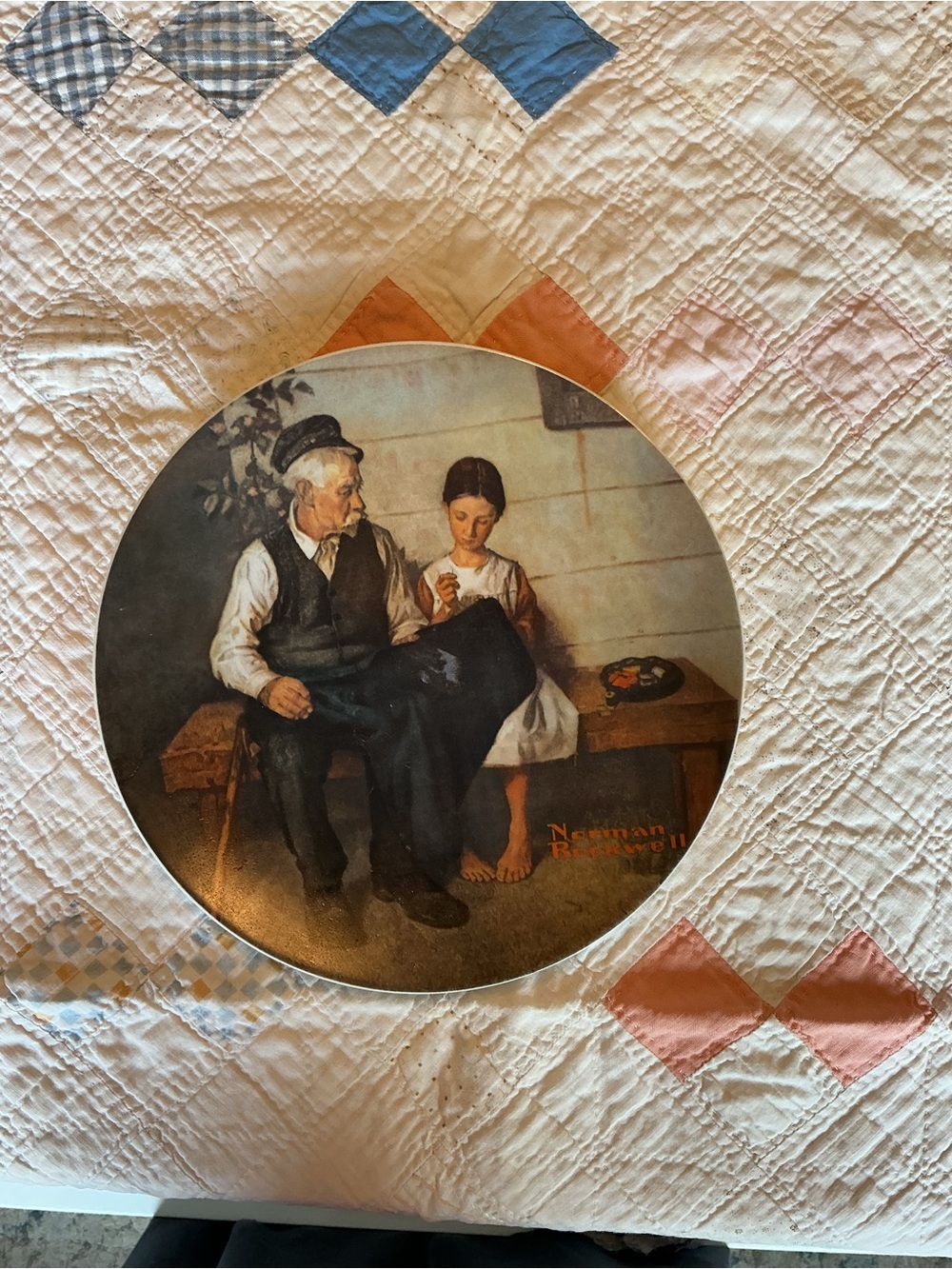 Norman Rockwell Round Wall Plaque in Brown, Cream, Blue